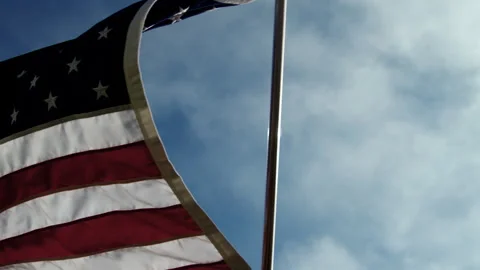 A American Flag Waves in the Wind with the Sky Behind It Stock Footage 270385830