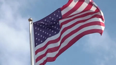 American flag waving on blue sky. United States Stock Footage 330131033