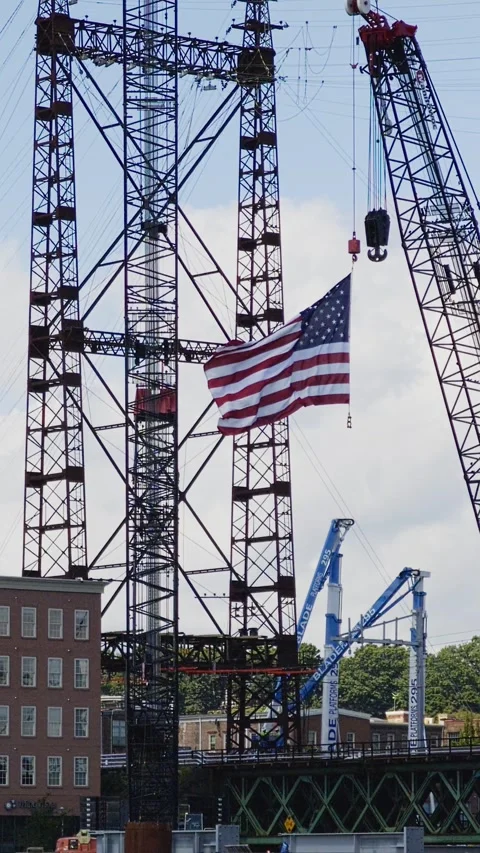 American flag waving on a bridge construction site 스톡 동영상 344806972