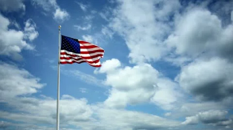 American Flag Waving Clouds Sky Beautiful USA United States US Stock Footage