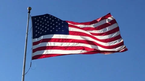 American Flag Waving CU wind bright Stock Footage 185574977