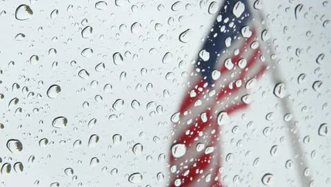 American Flag Waving in the Rain Stock Video Stock Footage