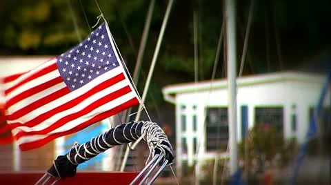 American flag is waving the on the sailboat Stock Footage