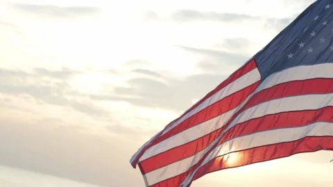 American Flag Waving in Sunset Light At The Beach Stock Footage 294558068