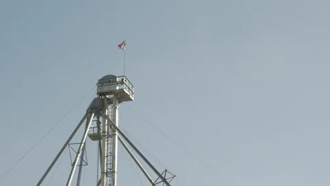 American flag waving on tower structure 動画素材 94470073