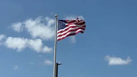 American Flag Waving in the Wind Against Blue Sky 스톡 동영상 341168312
