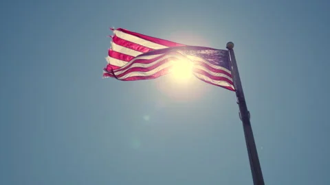 American Flag Waving in the Wind On a Bright Sunny Day Slow Motion 4K Video stock 307330998