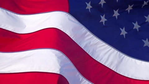 American flag waving in the wind. Closeup of American flag fabric folds Stock Footage 345542909