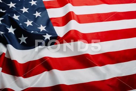 American flag waving in the wind. Flag USA as a patriotic background Stock Photos