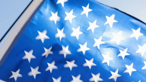 American flag waving from the wind. Stockbeeldmateriaal 137950355