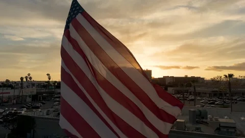 The American flag is waving in the wind At sunset Video stock 270184296