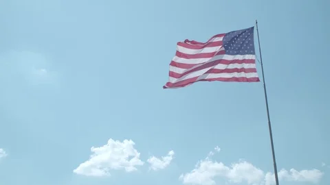 American Flag Wide Shot blowing in the wind Stock Footage