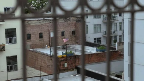 American flag in the wind on one of the Brooklyn rooftops. New York. Stock Footage 75282376