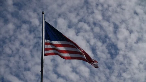 American Flag in the Wind Slow Motion Blue Sky HD 24p #2 Stock Footage 87539576