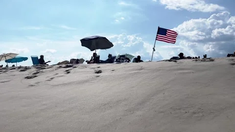 American Flag on a windy beach Video stock 236258701
