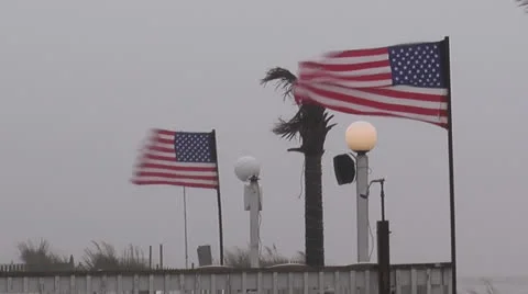 American flags blow in wind of storm Stock Footage 24233100