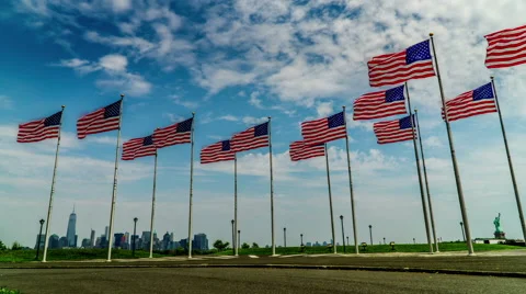 The American flags flew in the wind, background is Manhattan 스톡 동영상 63883744