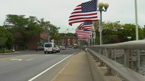 American Flags fly on a bridge in slow motion in Westport Connecticut Stock Footage 91147496