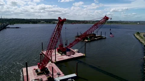 American Flags flying from cranes Stock Footage 139152009