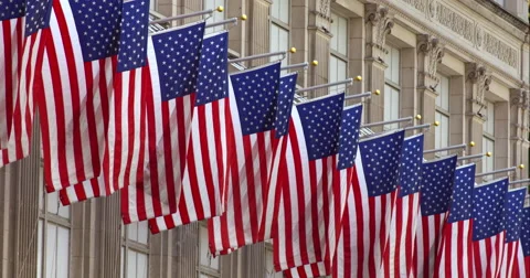 American flags in a row slowly flap in the breeze in New York City Stock Footage 67253389