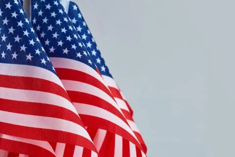 American Flags. Three American flags with stars and stripes on a light blue Stock Photos
