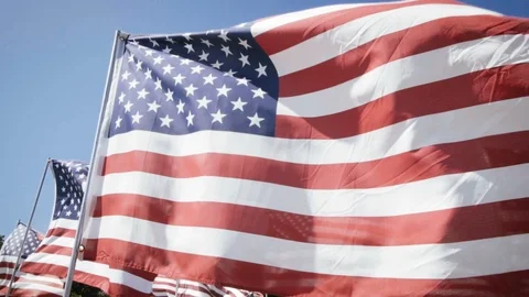 American flags waving with a blue sky background. independence day Stock Footage 87778763