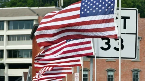 American flags waving on bridge over Saugatuck River Stock Footage 135676681