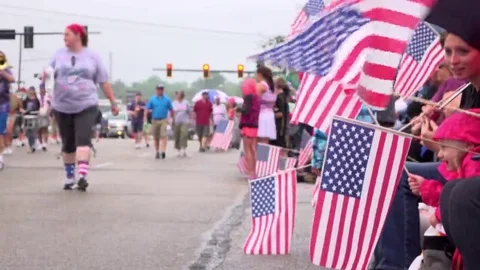 American flags waving on route of 4th of July Parade 4k Vídeos de archivo 69291232