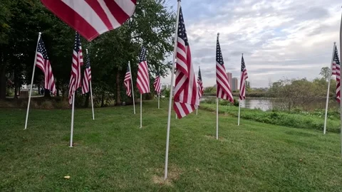 American Flags Waving in wind on riverfront Stock Footage 286163834