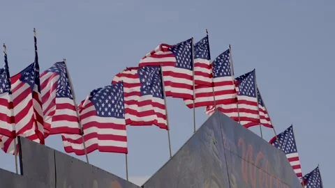 American flags waving in wind slow motion Video stock 333328238