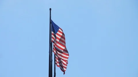 American Flags in the Wind Slow Motion Blue Sky HD 24p Stock Footage 87539529