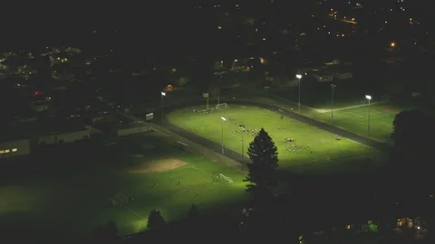 American football college field game aerial view night Stock Footage