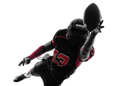 American football player catching ball  silhouette Stock Photos