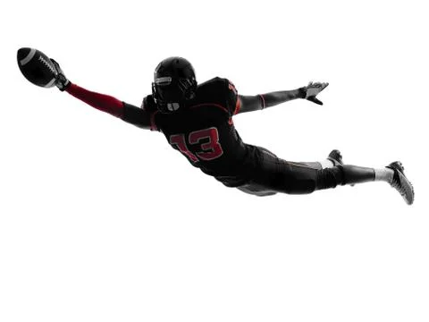 American football player scoring touchdown  silhouette Stock Photos