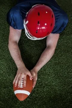 American football player scoring a touchdown Stock Photos