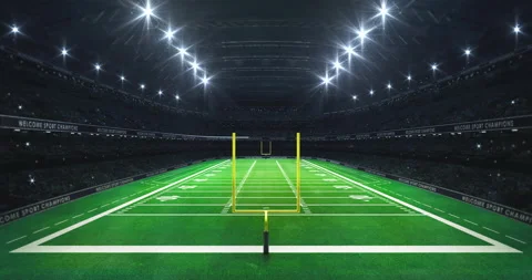 American football stadium with yellow goal posts on grass field from grandstand. Stock Footage