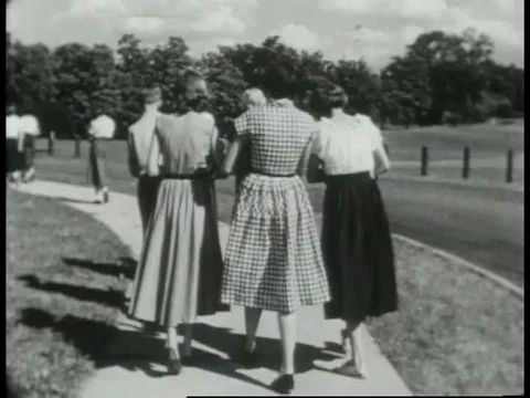 American high school students stroll home in the 1950s, two friends converse on Vídeo Stock 75275341