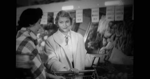 American housewife training Japanese brides to shop in departmental store Stock Footage