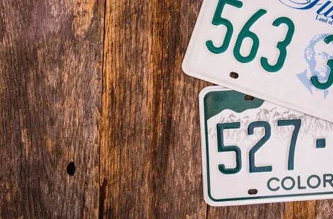 American License Plates on Wooden Background. Fotos de archivo