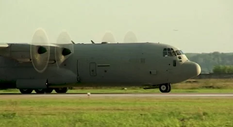 American Lockheed C-130 Hercules military transport aircraft moves along runway. Stock Footage 172486426