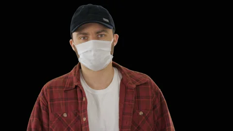 American man in cap and face mask walking, Alpha Channel Stock-Footage 130645710
