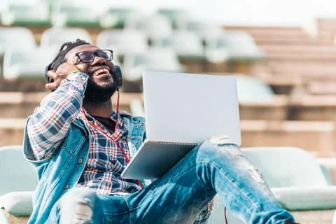 American man using laptop. Stock Photos