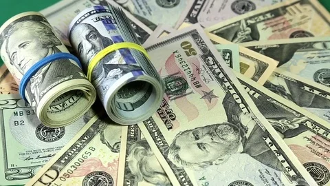 American money dollars on rotating surface close up. Stock-Footage 73988897