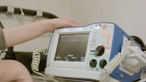 American Nurse Setting Up Defibrillator Machine in Hospital Stock Footage 111452723