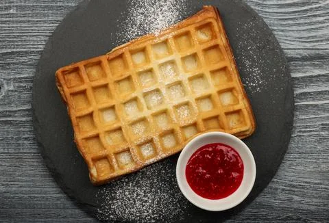 American or Belgian waffle with raspberry jam Stock Photos