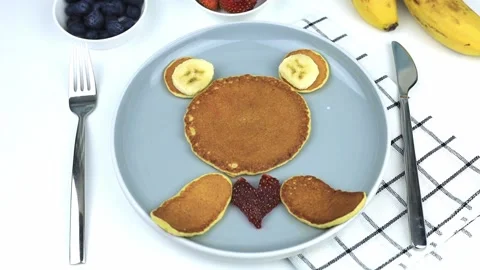 American pancake in the form of a bear cub with a heart Stock Footage 202212474