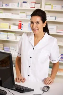 American pharmacist using computer in pharmacy 스톡 사진