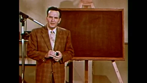 An American physicist explains Einstein's theory of relativity in 1957. Stock Footage 159331372