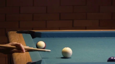 American Pool, young man is aiming to hit the cue ball Stock Footage 83657741