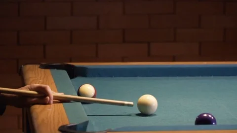 American Pool, young man is aiming to hit the cue ball. 120fps Stock Footage 83658617